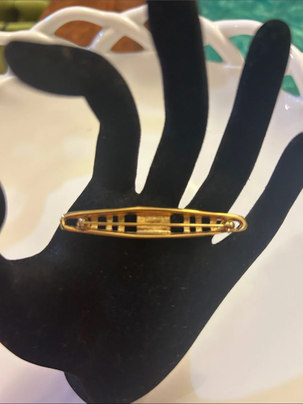 Monet vintage gold-tone tie bar features an openwork geometric design. 2 1/2”